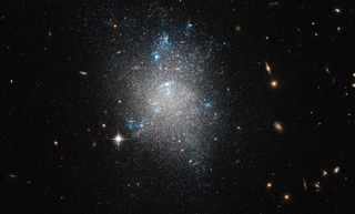Hubble photo of dwarf galaxy NGC 5477 located in the constellation of Ursa Major.