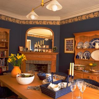 dining table with candles and tray with bowl