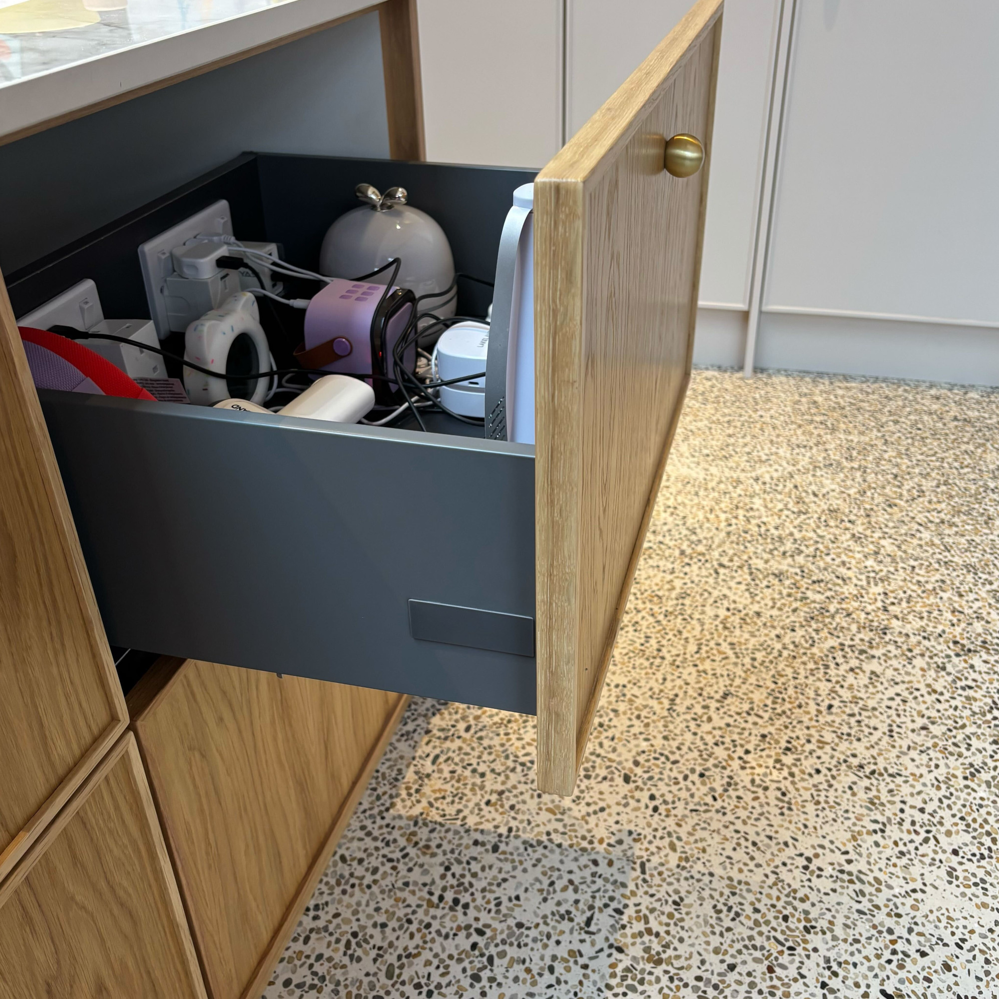 charging drawer open in a kitchen island