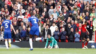 Manchester United goalkeeper David de Gea sits dejected after Chelsea’s Marcos Alonso (not pictured) scores his side’s first goal of the game during the Premier League match at Old Trafford, Manchester