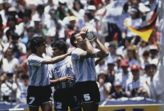 Jose Luis Brown kisses the ball after scoring for Argentina against West Germany in the 1986 World Cup final.