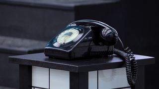 A black rotary phone as seen in Squid Game: The Challenge