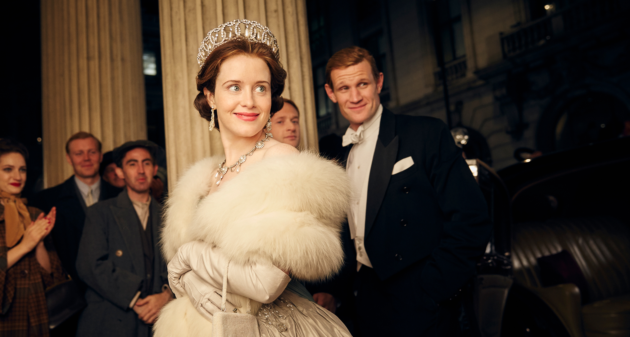 Claire Foy as Queen Elizabeth on The Crown wearing a tiara and fur stole