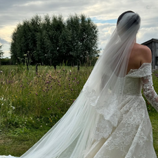 @livvperez wearing a lace wedding gown