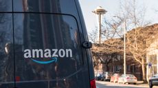 Amazon Prime Now Delivery van on 4th avenue late in the day with Seattle's Space Needle in the background.