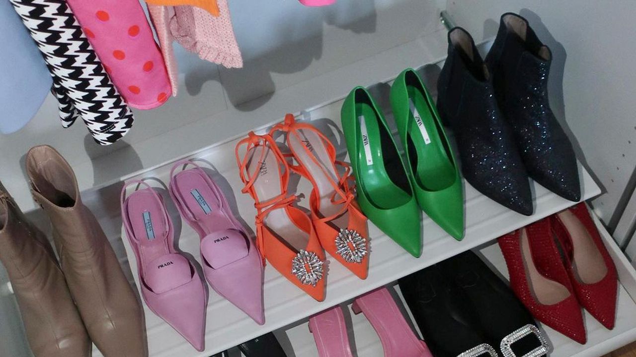 bright designer shoes in row on closet shelf