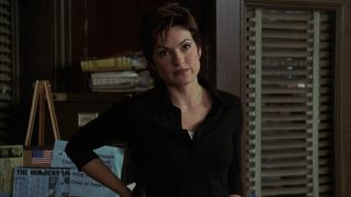 Mariska Hargitay with short hair leaning against a door on SVU.