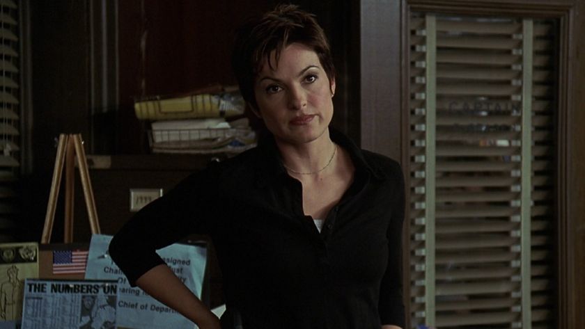 Mariska Hargitay with short hair leaning against a door on SVU.
