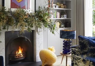 foliage garland over a fireplace