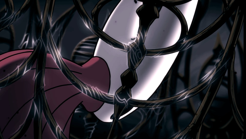 Hornet sits, defeated, inside a glimmering silvery cage.