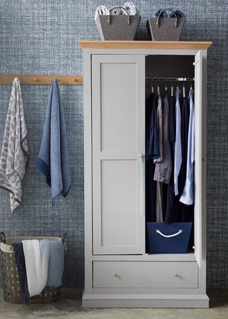 wardrobe with blue textured wall and cloths