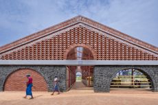 Gaugram , a cow shelter with pitched roofs and brick structure