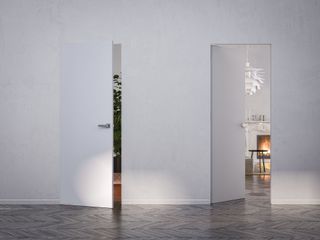 Doors opening inside a room with white walls