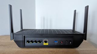 Linksys Hydra Pro 6E from the back on a table