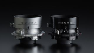 The Voigtlander Color-Skopar 35mm f/3.5 Aspherical VM in both silver and black sits against a dark background with the hoods attached