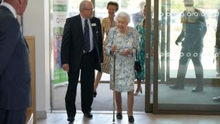 Queen Elizabeth II talks with Jonathan Jones, Chair of Trustees during a visit to officially open the new building at Thames Hospice