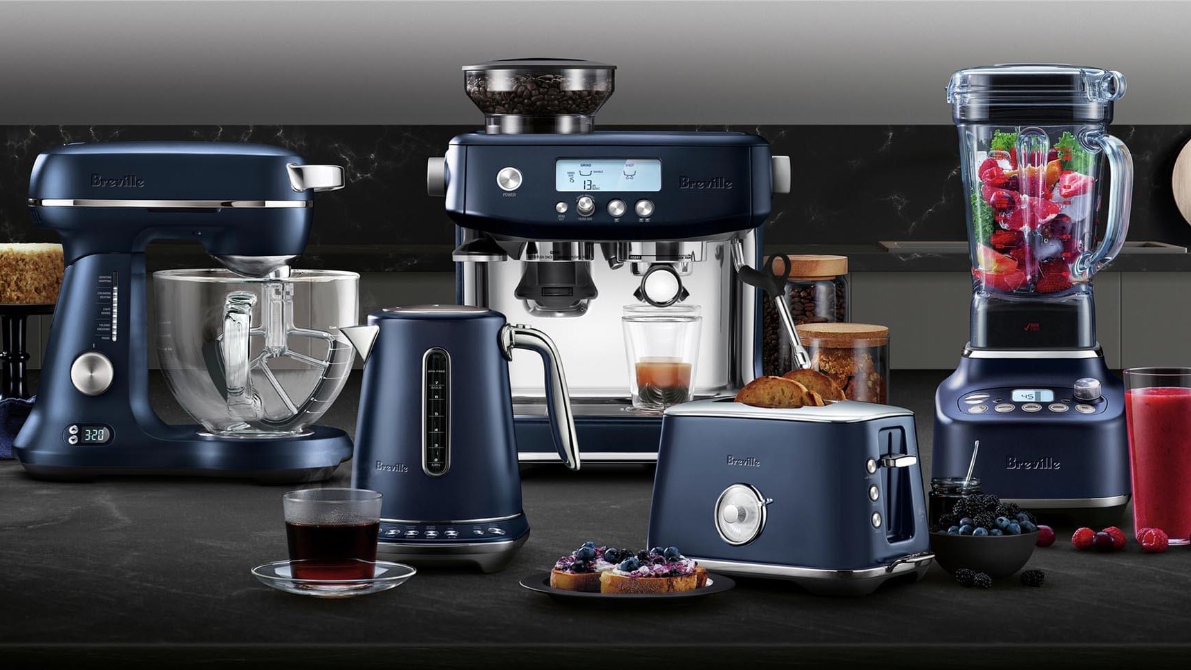 Breville kitchen appliances in dark blue colourway arranged on a countertop
