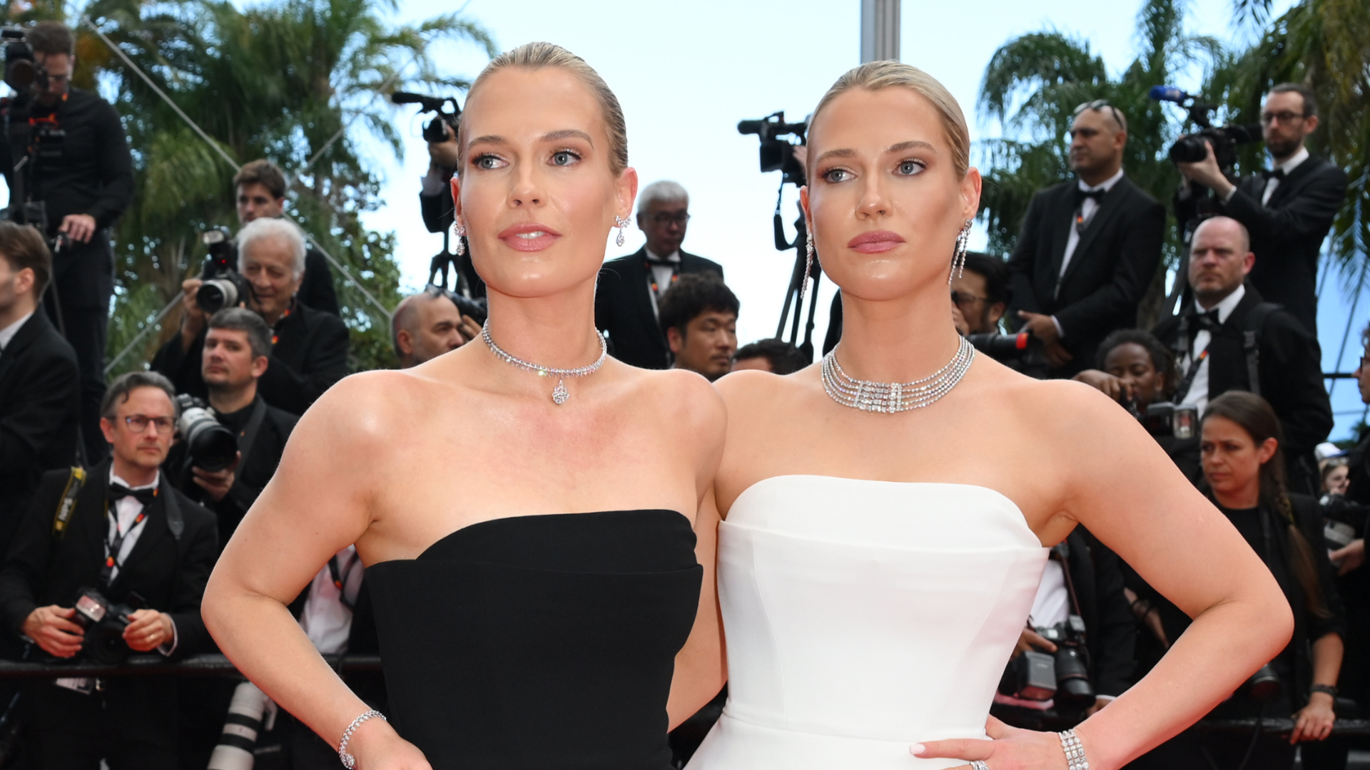 Amelia and Eliza Spencer wearing the same dress in black and white on the Cannes red carpet