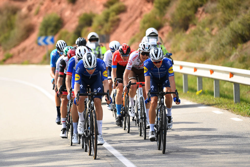 MANRESA SPAIN MARCH 26 James Knox of United Kingdom and Team Deceuninck QuickStep Rmi Cavagna of France and Team Deceuninck QuickStep Marc Soler Gimenez of Spain and Movistar Team David De La Cruz Melgarejo of Spain and UAE Team Emirates Thymen Arensman of Netherlands and Team DSM Ide Schelling of Netherlands and Team BORA Hansgrohe Attila Valter of Hungary and Team Groupama FDJ Matej Mohoric of Slovenia and Team Bahrain Victorious Bob Jungels of Luxembourg and Ag2R Citroen Team Omer Goldstein of Israel and Team Israel StartUp Nation during the 100th Volta Ciclista a Catalunya 2021 Stage 5 a 2015km stage from La Pobla De Segur to Manresa 220m Breakaway VoltaCatalunya100 on March 26 2021 in Manresa Spain Photo by David RamosGetty Images