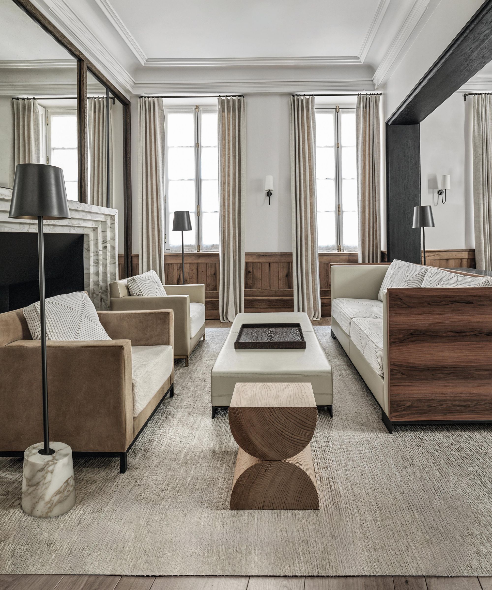 a modern designed sitting room in a French townhouse with tall ceilings