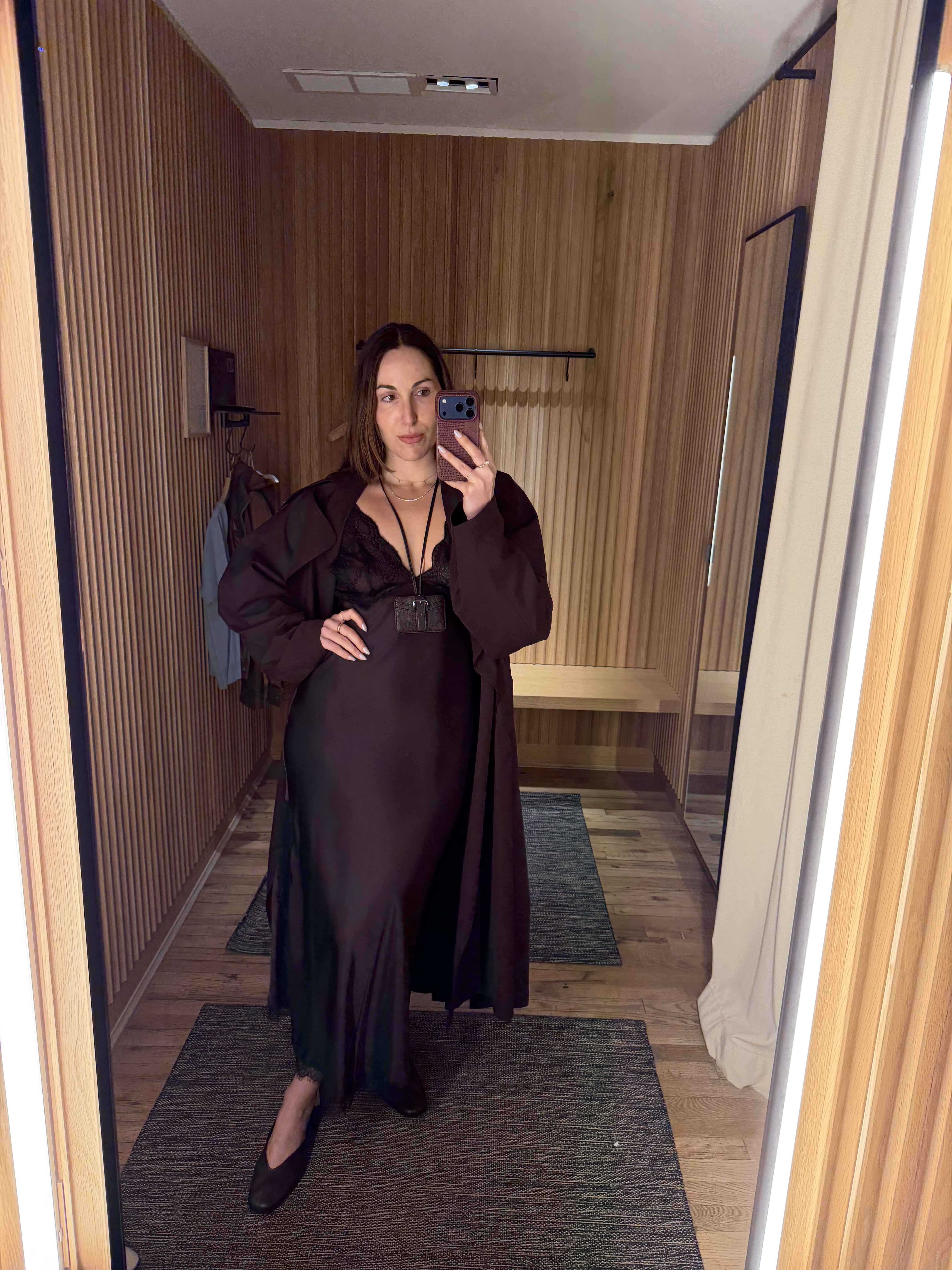 senior fashion editor Anna LaPlaca wearing Mango Selection pieces inside a store dressing room