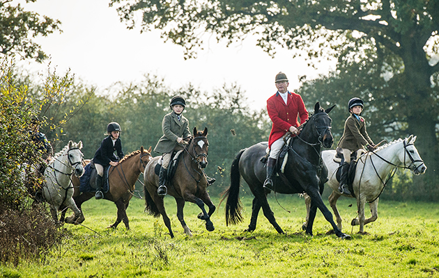 Neill Millard MFH and his son Will (on grey) and other young members of the Crawley &amp;amp; Horsham field enjoy their opening meet from Knepp Castle