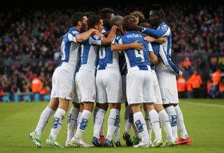 Espanyol players celebrate a goal against Barcelona in December 2014.