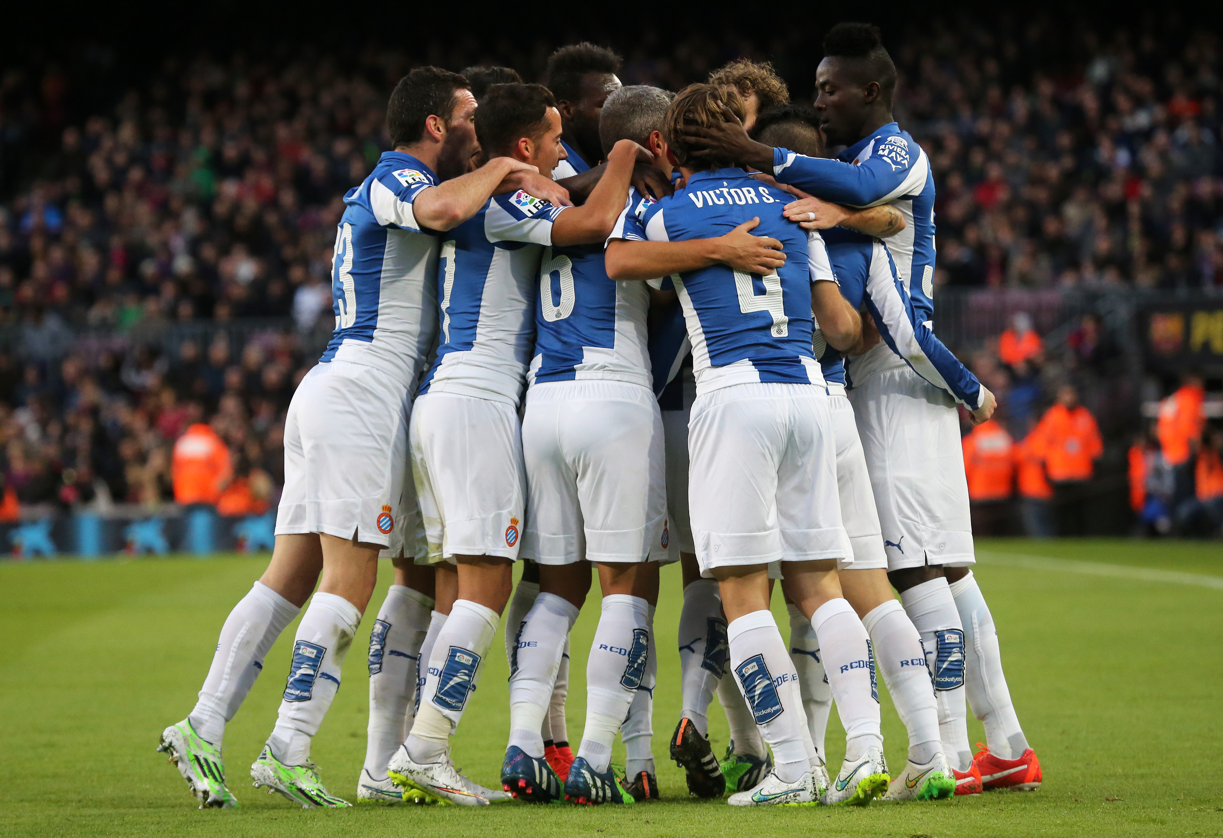 Espanyol players celebrate a goal against Barcelona in December 2014.