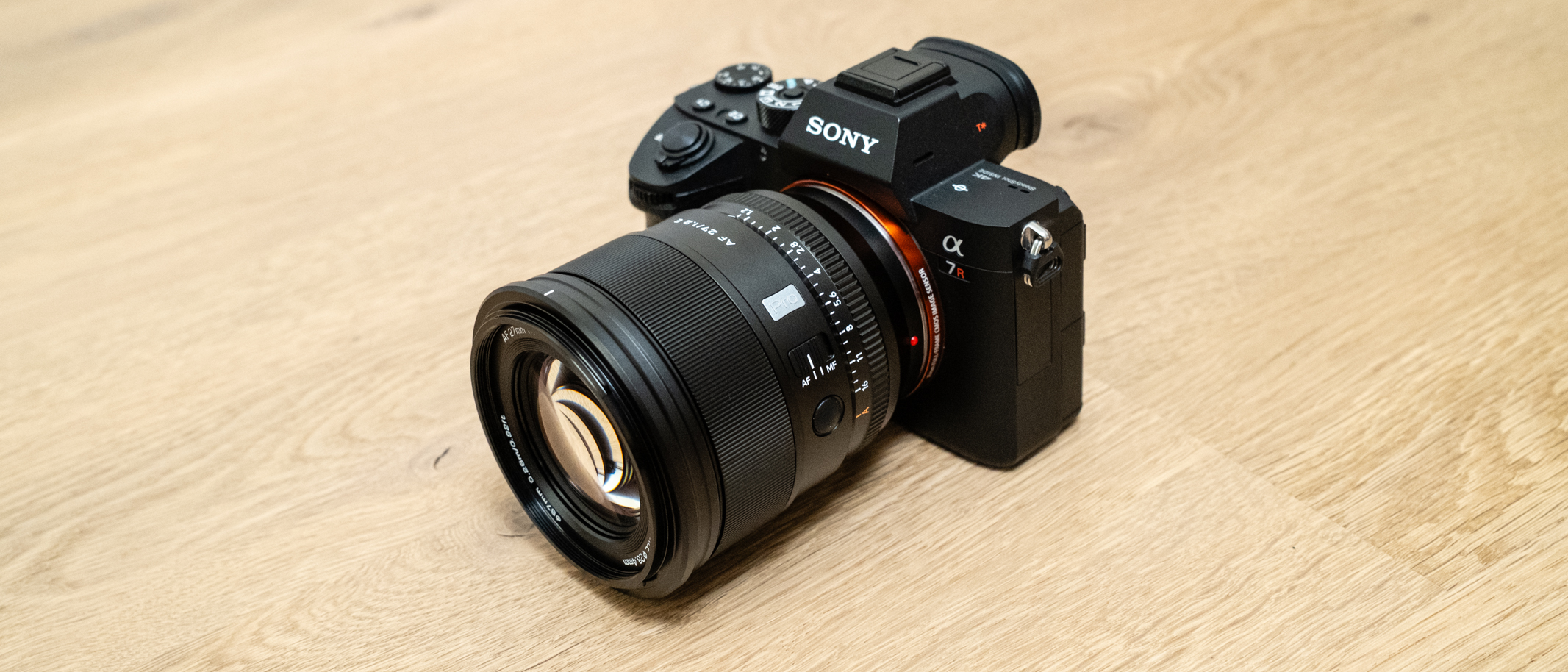 Viltrox AF 27mm f/ 1.2 Pro attached to a Sony A7R III on a wooden floor