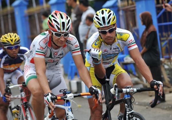 Two of Azad University Cross Team Iran riders joke during the race.