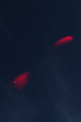 NASA photographer Jamie Adkins captures the glowing red clouds created during a sounding rocket launch from the agency's Wallops Flight Facility on Wallops Island, Va., on Jan. 29, 2013.