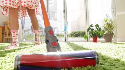 TikTok carpet cleaning hack: Woman Vacuuming Rug 