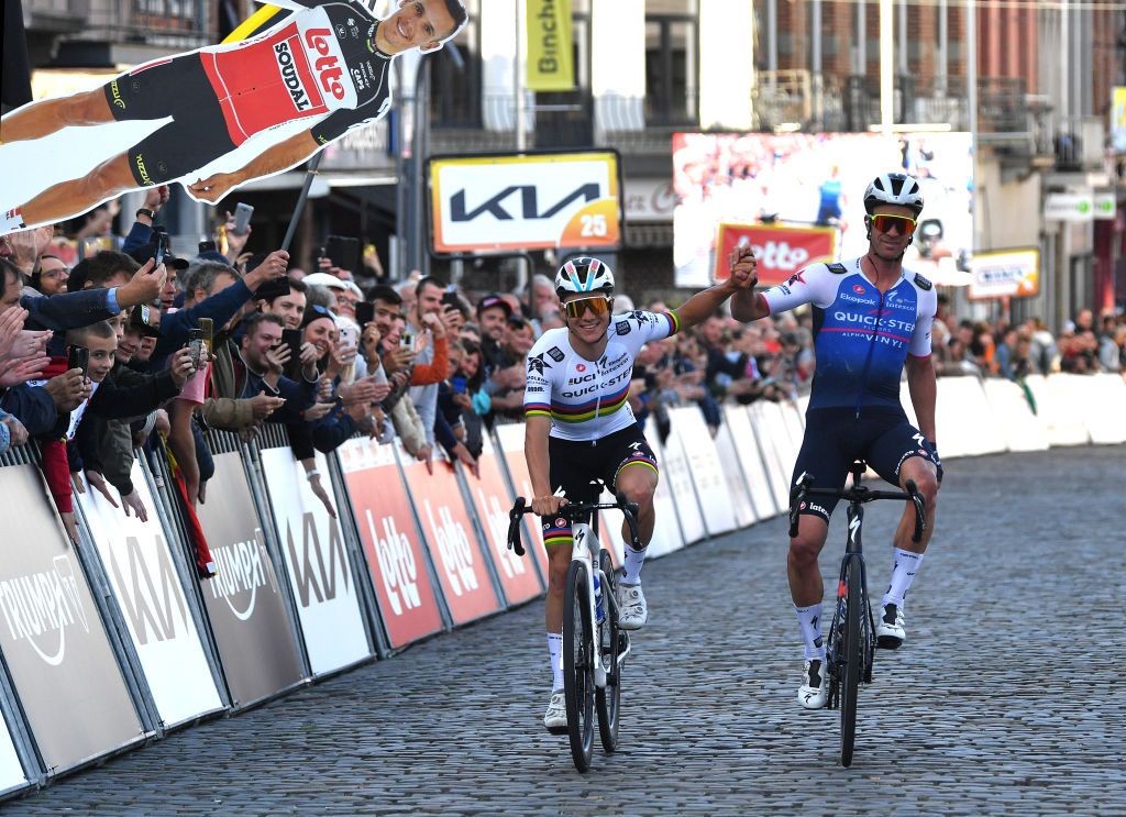 BINCHE BELGIUM OCTOBER 04 LR Remco Evenepoel of Belgium and Iljo Keisse of Belgium and Team QuickStep Alpha Vinyl react at finish line during the 35th Binche Chimay Binche Memorial Frank Vandenbroucke 2022 a 1986km one day race from Binche to Binche BincheChimayBinche on October 04 2022 in Binche Belgium Photo by Luc ClaessenGetty Images