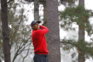 Tiger Woods plays a shot