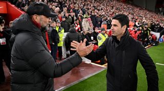 Arsenal and Liverpool managers Mikel Arteta and Jurgen Klopp shake hands at Anfield in December 2023.
