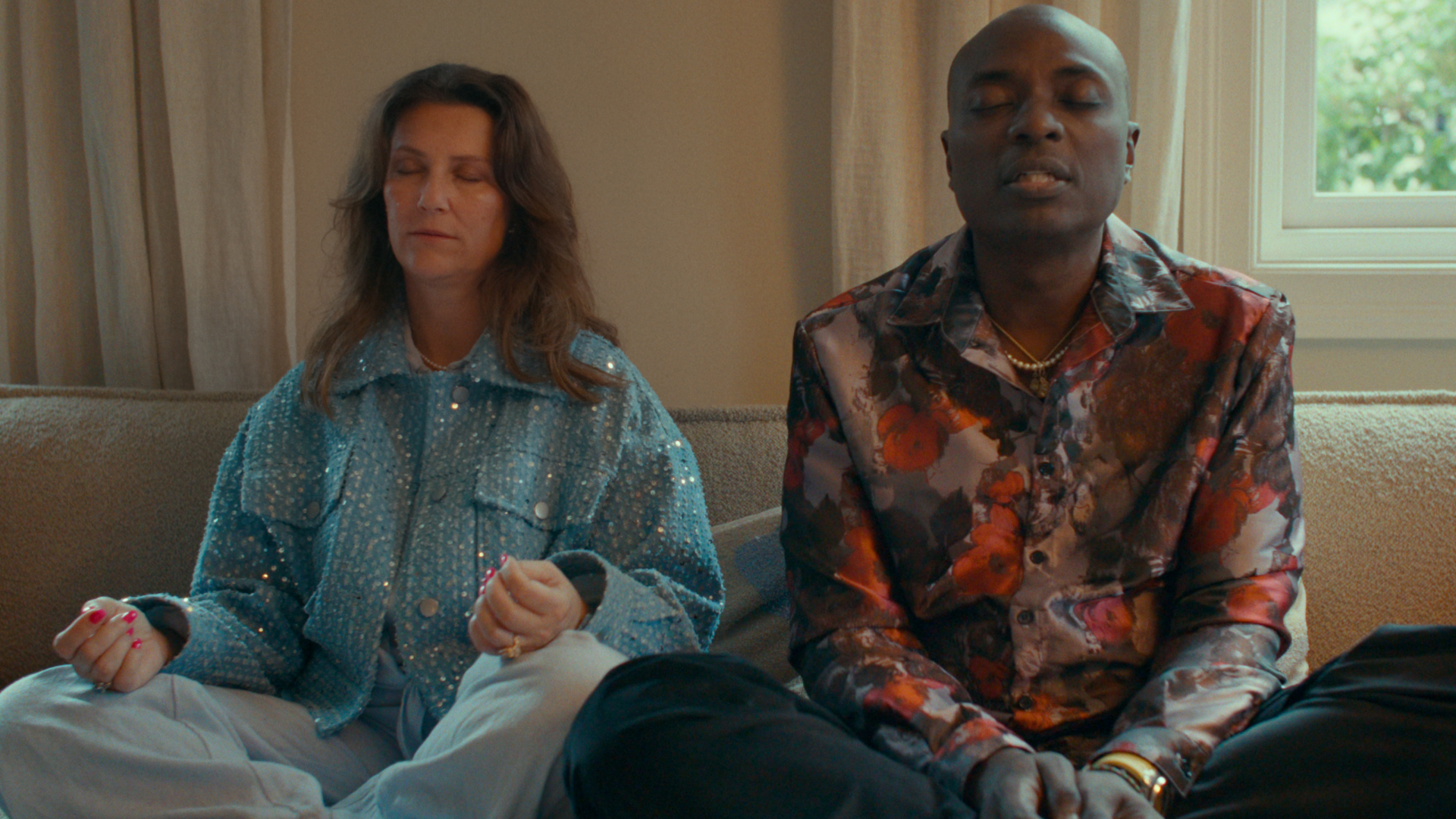 Princess Martha Louise and Durek Verrett sitting on the floor meditating with their eyes closed