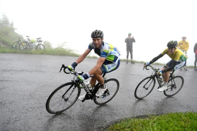 Michael Albasini helps teammate Cameron Meyer towards the end of the third stage of the Tour de Suisse