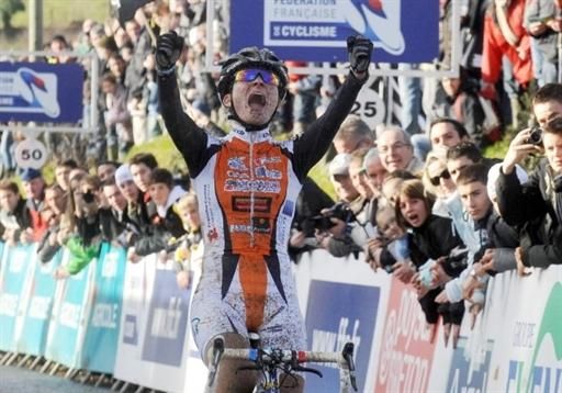 Caroline Mani gives an emphatic victory salute after winning the French championship