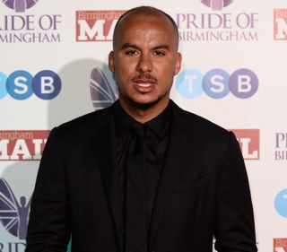 Gabriel Agbonlahor in a black suit at the Pride of Birmingham awards