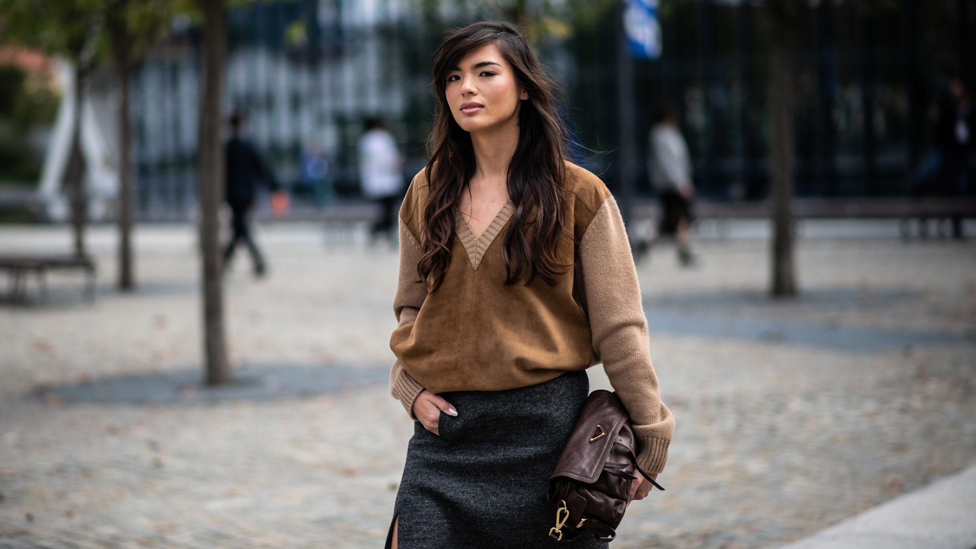 milan spring 2026 fashion week attendee wearing brown v-neck sweater
