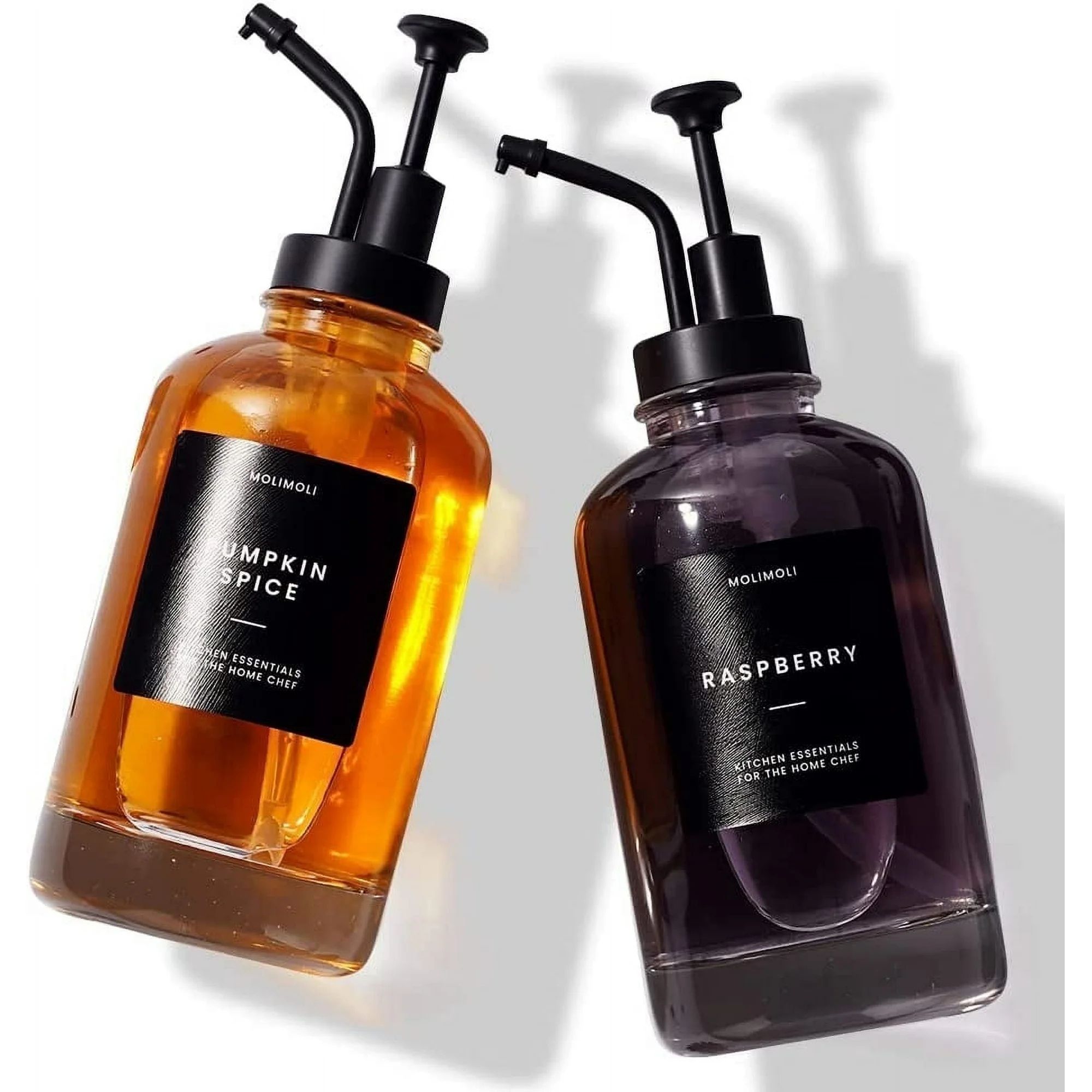Two plastic syrup dispenser bottles with black pumps