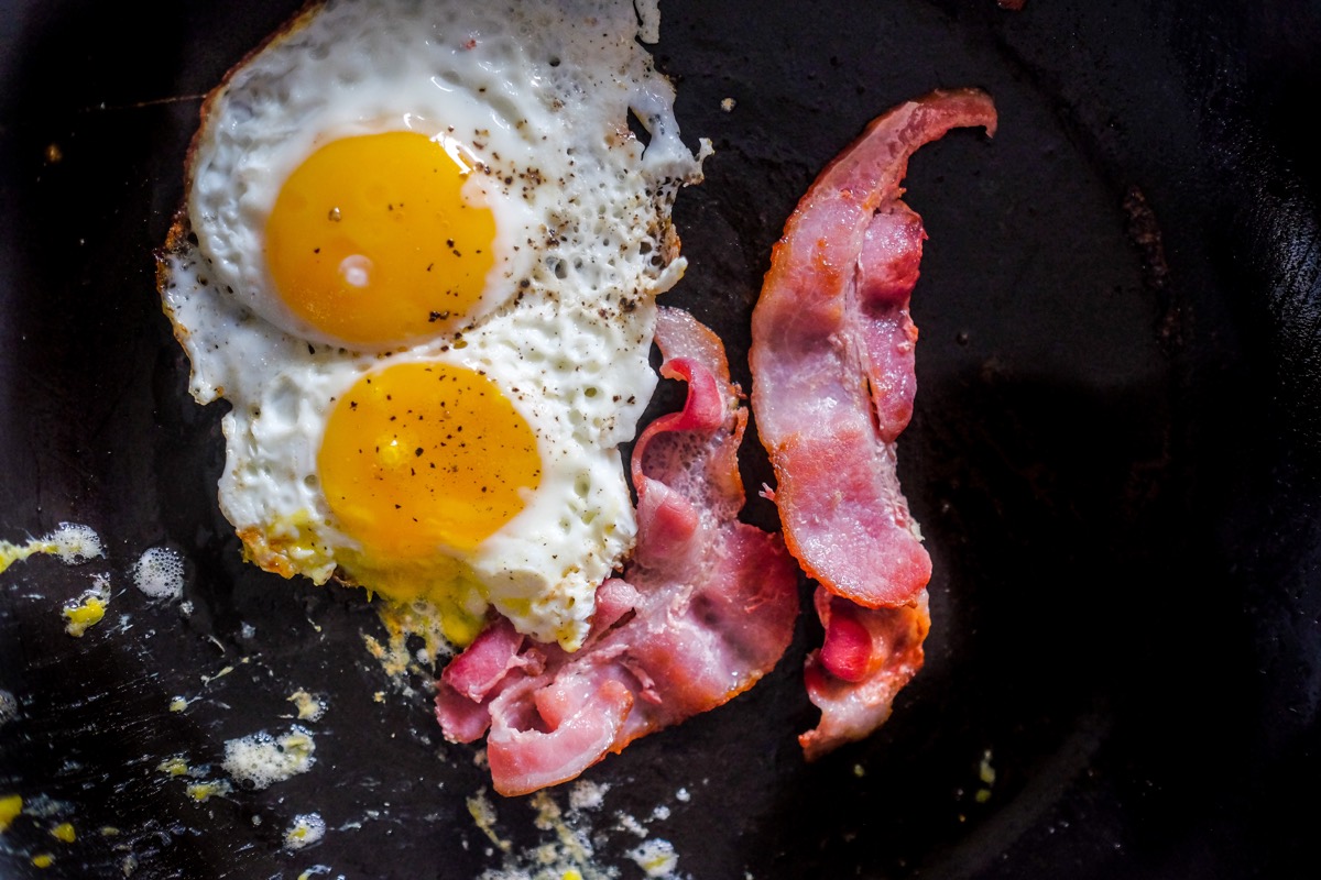 Keto diet - eggs and bacon on a frying pan