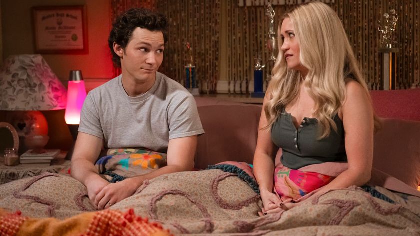 Georgie and Mandy look at each other in bed