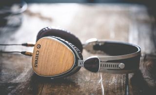 A headset is placed in the wooden bench