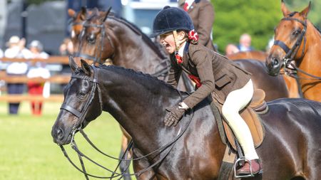 Heidi Cooper and Dowhills Nuage Noir in The show Hunter Pony Championship at The Royal Windsor Horse Show