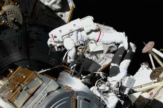 NASA astronauts Tom Marshburn (at left) and Kayla Barron are seen outside of the Quest airlock at the International Space Station during a spacewalk on Thursday, Dec. 2, 2021. Experts are continuing to study how space affects the human body.
