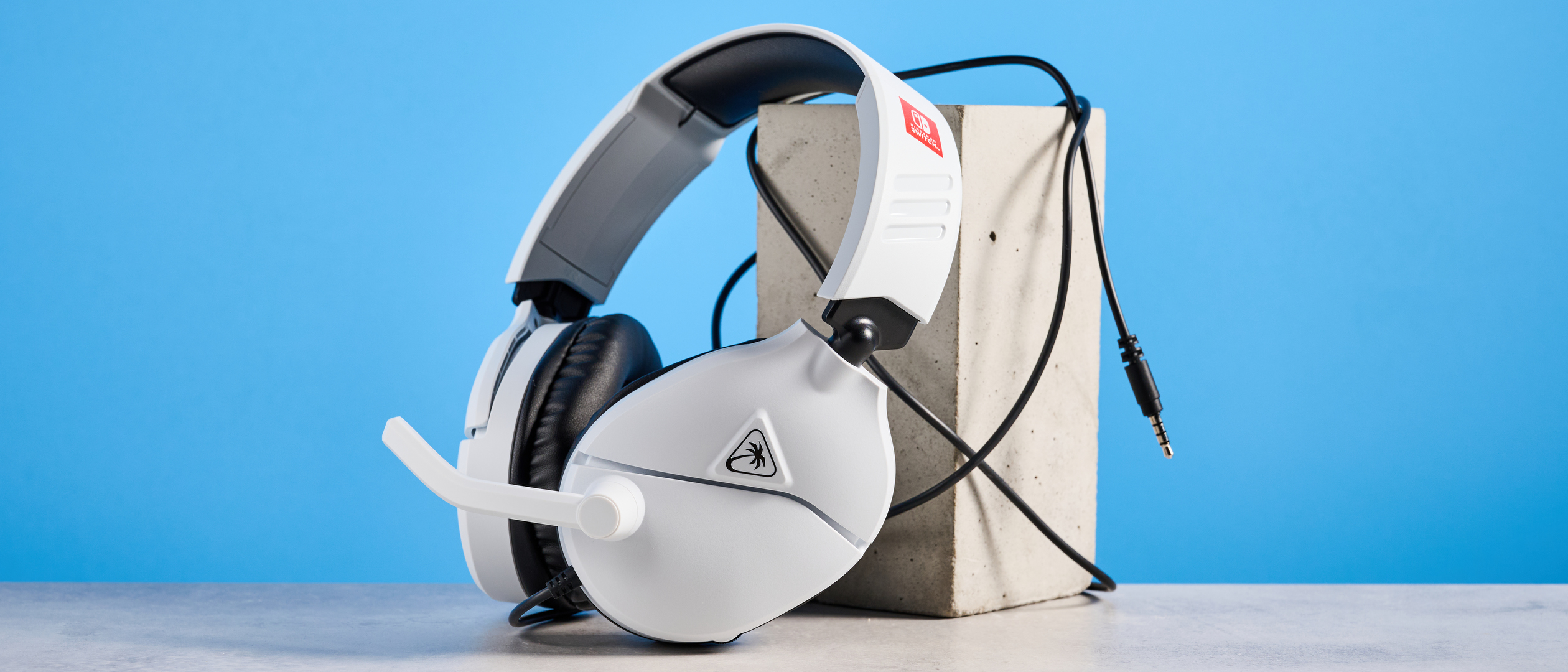 A white Turtle Beach Recon 70 wired gaming headset for Nintendo Switch