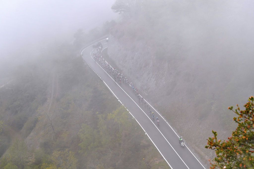THYON 2000 LES COLLONS SWITZERLAND MAY 01 The Peloton passing through foggy landscape at climb of Suen 1430m during the 74th Tour De Romandie 2021 Stage 4 a 1613km stage from Sion to Thyon 2000 Les Collons 2076m Landscape Vineyards TDR2021 TDRnonstop UCIworldtour on May 01 2021 in Thyon 2000 Les Collons Switzerland Photo by Luc ClaessenGetty Images