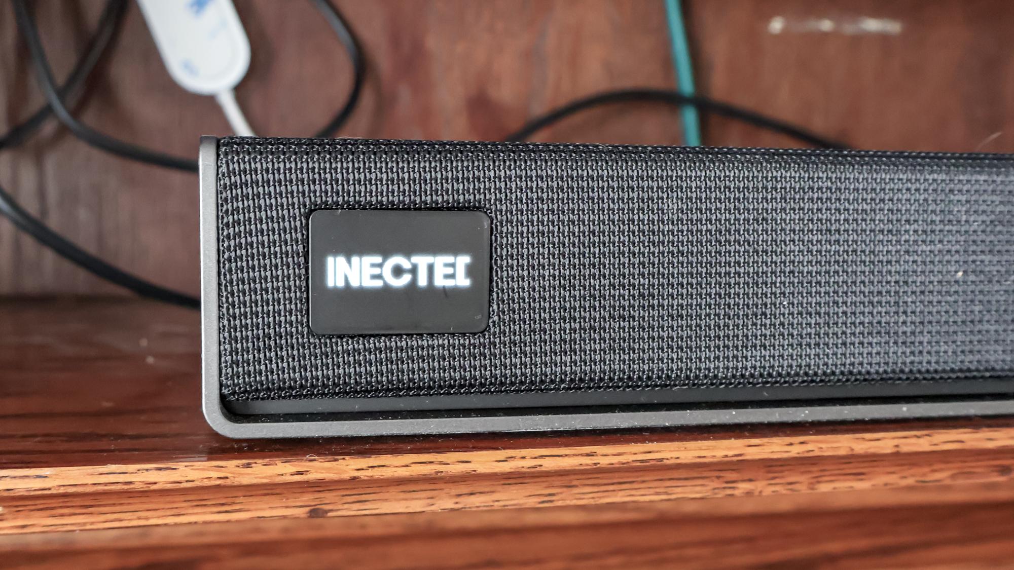 LG Sound Suite H7 Soundbar on a TV stand