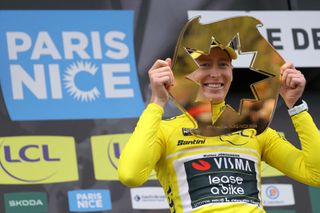 First placed Team Visma-Lease a Bike's US cyclist Matteo Jorgenson poses with the trophy on the podium after winning the 82nd edition of the Paris-Nice cycling race, on March 10, 2024. (Photo by Thomas SAMSON / AFP)